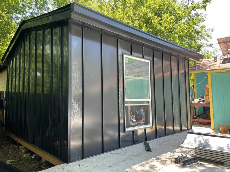 Black standing seam metal wall panels for Roof Inspection in Belvedere